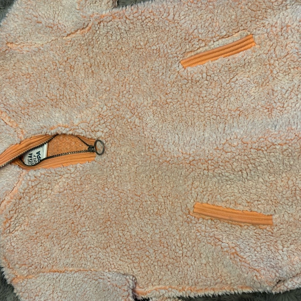 Sweatshirt. Fuzzy. Has 3/4 zipper.